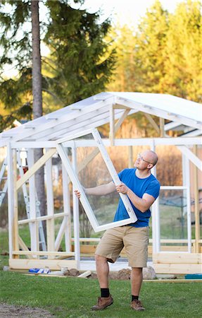 simsearch:6126-08644873,k - Finland, Keski-Suomi, Jyvaskyla, Man building greenhouse Foto de stock - Sin royalties Premium, Código: 6126-08644771