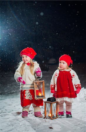 finnish people in the snow - Finland, Sisters (12-17 months, 2-3) standing in backyard at night Stock Photo - Premium Royalty-Free, Code: 6126-08644726