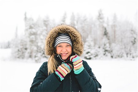 finnish people in the snow - Finland, Jyvaskyla, Saakoski, Portrait of young woman in winter coat Stock Photo - Premium Royalty-Free, Code: 6126-08644875