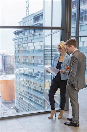 exterior of modern office - Finland, Helsinki, Business people discussing project in corridor Stock Photo - Premium Royalty-Free, Code: 6126-08644897