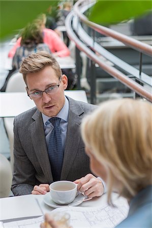 finland food - Finland, Helsinki, Businessman at meeting in cafe Stock Photo - Premium Royalty-Free, Code: 6126-08644895