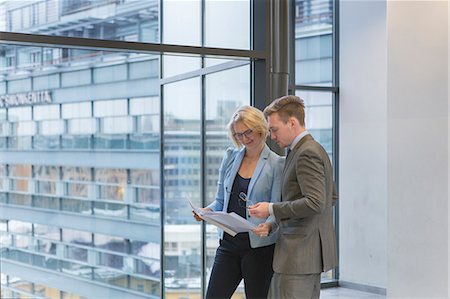 exterior of modern office - Finland, Helsinki, Business people discussing project in corridor Stock Photo - Premium Royalty-Free, Code: 6126-08644898