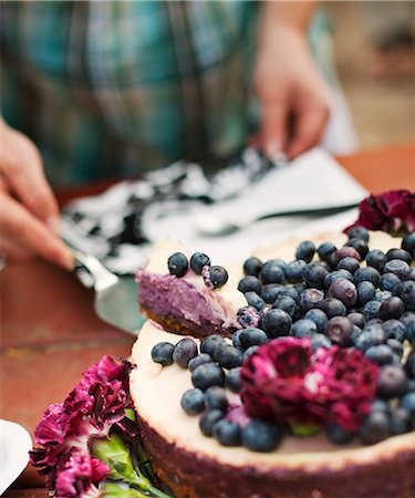 swedish berries - Sweden, Woman serving blueberry cake Stock Photo - Premium Royalty-Free, Code: 6126-08658957