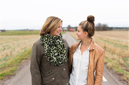 simsearch:6108-08662912,k - Sweden, Ostergotland, Mjolby, Mother and daughter (14-15) standing face to face Stock Photo - Premium Royalty-Free, Code: 6126-08659060