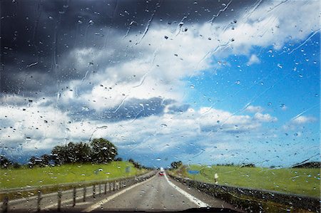 simsearch:6126-08642990,k - Sweden, Skane, Country road seen through wet windshield Stock Photo - Premium Royalty-Free, Code: 6126-08635087