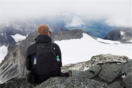 Norway, Jotunheimen, Bovertun, Hiker looking at mountains Stock Photo - Premium Royalty-Free, Code: 6126-08635088