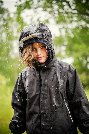 swedish - Sweden, Uppland, Blond girl (8-9) in raincoat Stock Photo - Premium Royalty-Free, Code: 6126-08635369