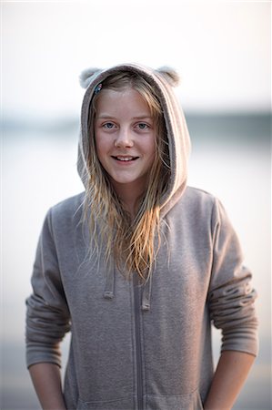 Sweden, Dalarna, Siljan, Girl (12-13) wearing bear print hoodie Stock Photo - Premium Royalty-Free, Code: 6126-08635320