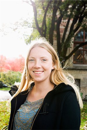 school outdoor - Sweden, Vastra Gotaland, Gothenburg, School of Business, Economics and Law, Portrait of young woman standing by university Stock Photo - Premium Royalty-Free, Code: 6126-08635482