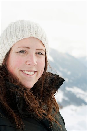 simsearch:6126-08635314,k - Austria, Vorarlberg, Portrait of smiling woman in mountains Stock Photo - Premium Royalty-Free, Code: 6126-08635430