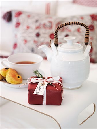 rustic bedroom - Close up of present, cookie and tea Stock Photo - Premium Royalty-Free, Code: 6126-08635965