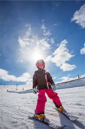 Norway, Osterdalen, Trysil, Girl (4-5) learning how to ski Stock Photo - Premium Royalty-Free, Code: 6126-08636009