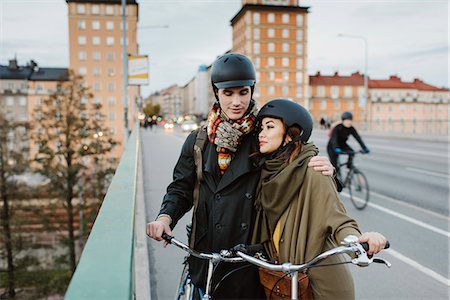 simsearch:6126-08636176,k - Sweden, Uppland, Stockholm, Vasatan, Sankt Eriksgatan, Young couple with bicycles on street Stock Photo - Premium Royalty-Free, Code: 6126-08636174