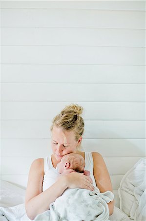 Sweden, Mid-adult woman holding baby boy (0-1 months) in her arms Stock Photo - Premium Royalty-Free, Code: 6126-08636104