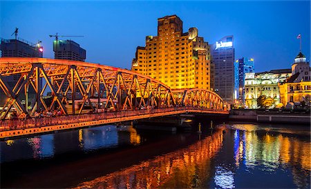 simsearch:6108-08841764,k - China, Shanghai, Lujiazu, Bridge with city buildings in background at night Stock Photo - Premium Royalty-Free, Code: 6126-08636274