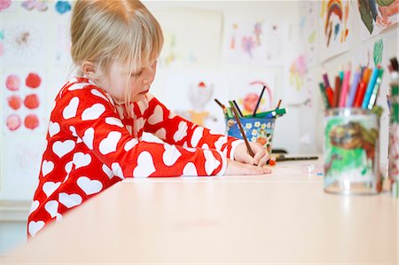 six year old sweatshirt - Girl (6-7) drawing at table Stock Photo - Premium Royalty-Free, Code: 6126-08636540
