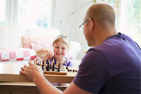 simsearch:6126-08636742,k - Father learning daughter (6-7) play chess Stock Photo - Premium Royalty-Free, Code: 6126-08636536