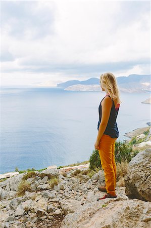 Greece, Dodecanese, Kalymnos, Tourist looking at sea Stock Photo - Premium Royalty-Free, Code: 6126-08636728