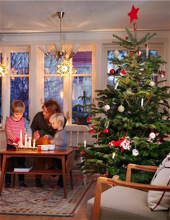 simsearch:6102-08942558,k - Sweden, Woman and boys at table by christmas tree Stock Photo - Premium Royalty-Free, Code: 6126-08781197