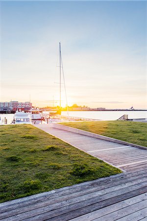 floating dock - Sweden, Skane, Malmo, Kranplatsen, Promenade at sunset Stock Photo - Premium Royalty-Free, Code: 6126-08781480