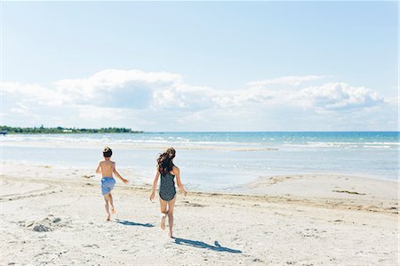 preteen swedish girl - Sweden, Oland, Kopingsvik, Girl (10-11) and boy (8-9) running on beach Stock Photo - Premium Royalty-Free, Code: 6126-08781413