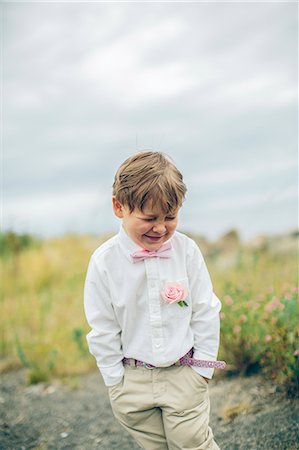 simsearch:6126-08635937,k - Sweden, Blekinge, Karlskrona, Aspo, Well dressed boy (6-7) smiling Stock Photo - Premium Royalty-Free, Code: 6126-08781430