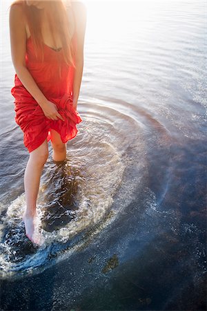 dress wading water - Finland, Pirkanmaa, Tampere, Pyhajarvi, Woman in red dress standing in lake Stock Photo - Premium Royalty-Free, Code: 6126-08781573
