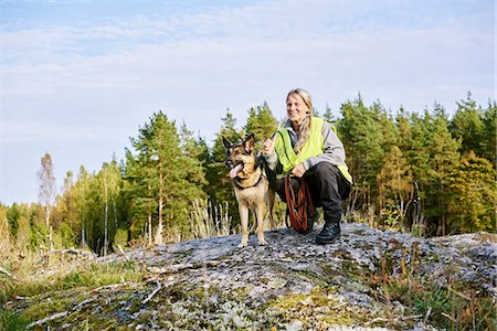 scandinavian woman 50 years old - Portrait of volunteer with dog helping emergency services find missing people Stock Photo - Premium Royalty-Free, Code: 6126-09102429