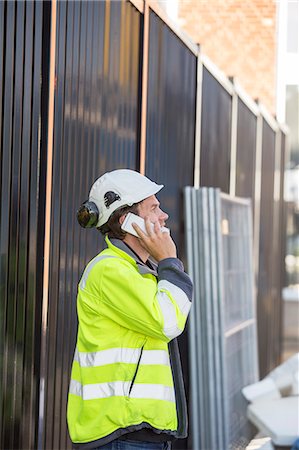 simsearch:6126-08644036,k - Man using smartphone in construction site Stock Photo - Premium Royalty-Free, Code: 6126-09102981