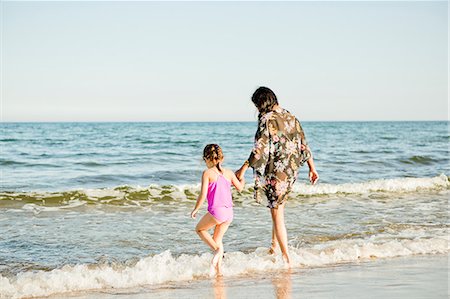 dress wading water - Mother and daughter on beach in Friseboda, Sweden Stock Photo - Premium Royalty-Free, Code: 6126-09103048