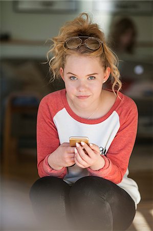 Teenage girl looking at camera with confidence Stock Photo - Premium Royalty-Free, Code: 6126-09103132