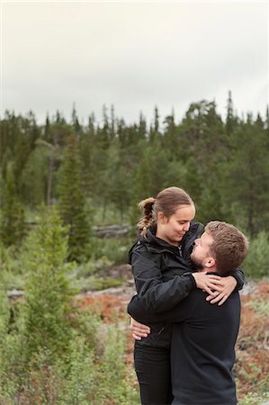 simsearch:6126-09103925,k - Couple embracing in forest in Sodra Lapland, Sweden Stock Photo - Premium Royalty-Free, Code: 6126-09103998