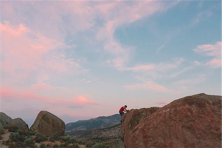 simsearch:6126-09104159,k - Man climbing rock in Buttermilk Country Stock Photo - Premium Royalty-Free, Code: 6126-09104164