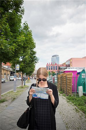 simsearch:6126-08659298,k - Young woman in Berlin with city map Stock Photo - Premium Royalty-Free, Code: 6126-09104233