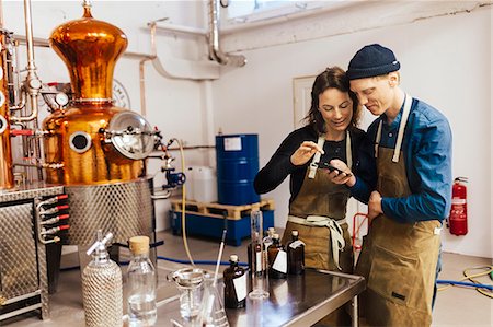 simsearch:6126-09103925,k - Workers at gin distillery in Sweden Stock Photo - Premium Royalty-Free, Code: 6126-09104533