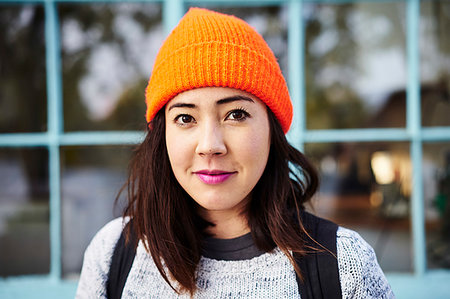 simsearch:640-02657383,k - Young woman with orange beanie Stock Photo - Premium Royalty-Free, Code: 6126-09266200