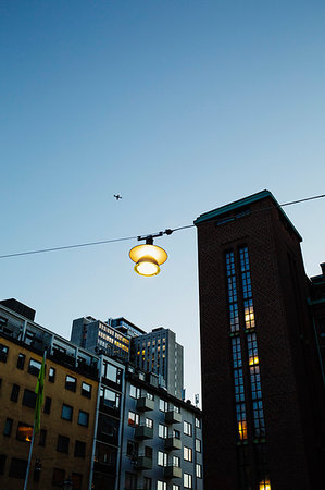 simsearch:6102-07158178,k - A light hanging over a street in Sodermalm, Stockholm Photographie de stock - Premium Libres de Droits, Code: 6126-09266504