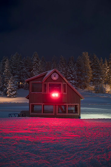 Log cabin in snow with red light Stock Photo - Premium Royalty-Free, Image code: 6126-09266895