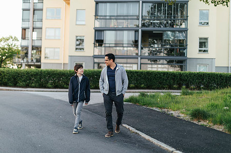 simsearch:6126-09103675,k - Father and son walking on a city street Stock Photo - Premium Royalty-Free, Code: 6126-09267264