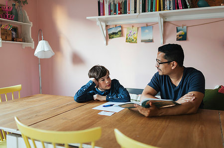 simsearch:6126-09103675,k - Father helping his son with homework Stock Photo - Premium Royalty-Free, Code: 6126-09267275