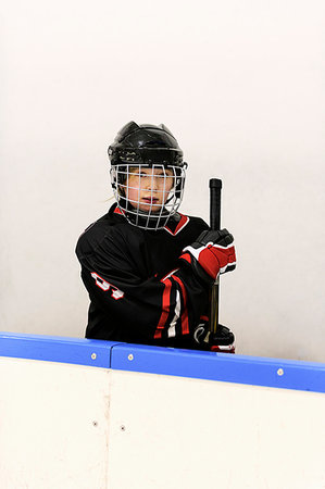 simsearch:6126-09268052,k - Girl in ice hockey uniform Photographie de stock - Premium Libres de Droits, Code: 6126-09268054