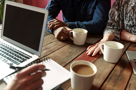 simsearch:6126-09267665,k - Arms of businesspeople on office table during meeting Photographie de stock - Premium Libres de Droits, Code: 6126-09268159