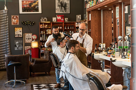 Barber drying young man´s hair Stock Photo - Premium Royalty-Free, Code: 6126-09268208