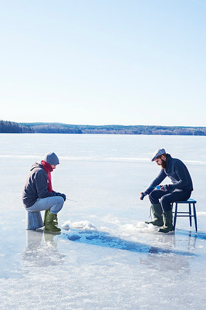 friends and buckets - Fishing on a frozen lake in Dalarna, Sweden Stock Photo - Premium Royalty-Free, Code: 6126-09204347
