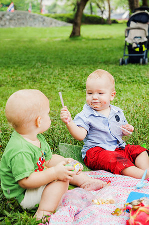 Baby boys at birthday picnic Stock Photo - Premium Royalty-Free, Code: 6126-09204352