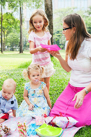 Mother with children at birthday picnic Stock Photo - Premium Royalty-Free, Code: 6126-09204355