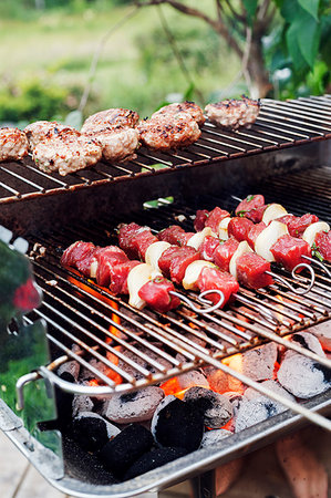 simsearch:6126-09103829,k - Meat and skewers on a barbeque grill Stock Photo - Premium Royalty-Free, Code: 6126-09204384