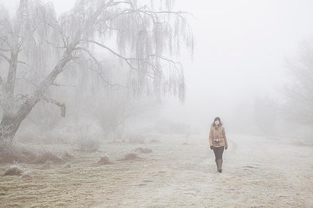 frosty walk countryside - Teenage girl walking through mist in Blekinge, Sweden Stock Photo - Premium Royalty-Free, Code: 6126-09204568