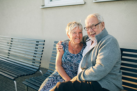 Portrait of senior couple hugging on bench Stock Photo - Premium Royalty-Free, Code: 6126-09204588