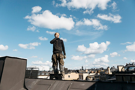 Roofer on a work break in Stockholm, Sweden Stock Photo - Premium Royalty-Free, Code: 6126-09204714